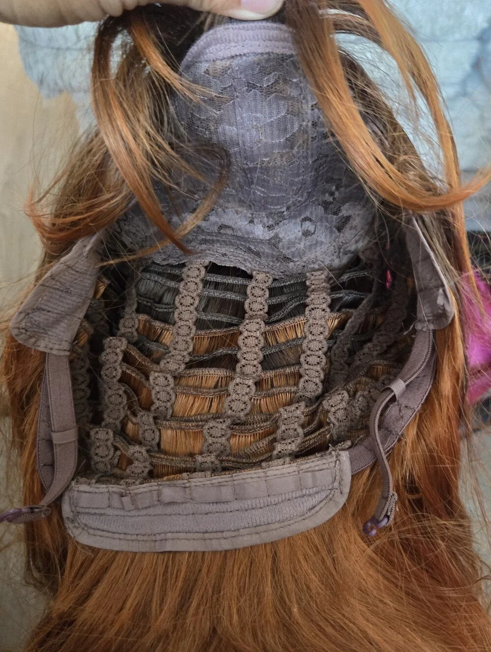 long auburn wig with dark brown roots and face-framing wispy bangs Sunthetic